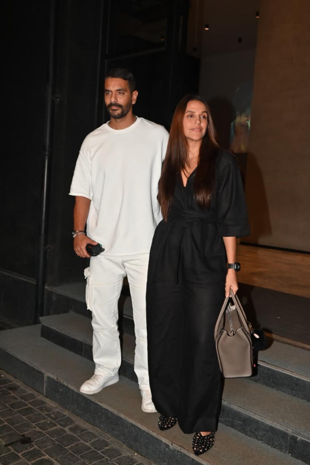Neha Dhupia and Angad Bedi kept their look stylish yet effortless. Neha opted for a chic black jumpsuit while complemented her in an all-white casual outfit.